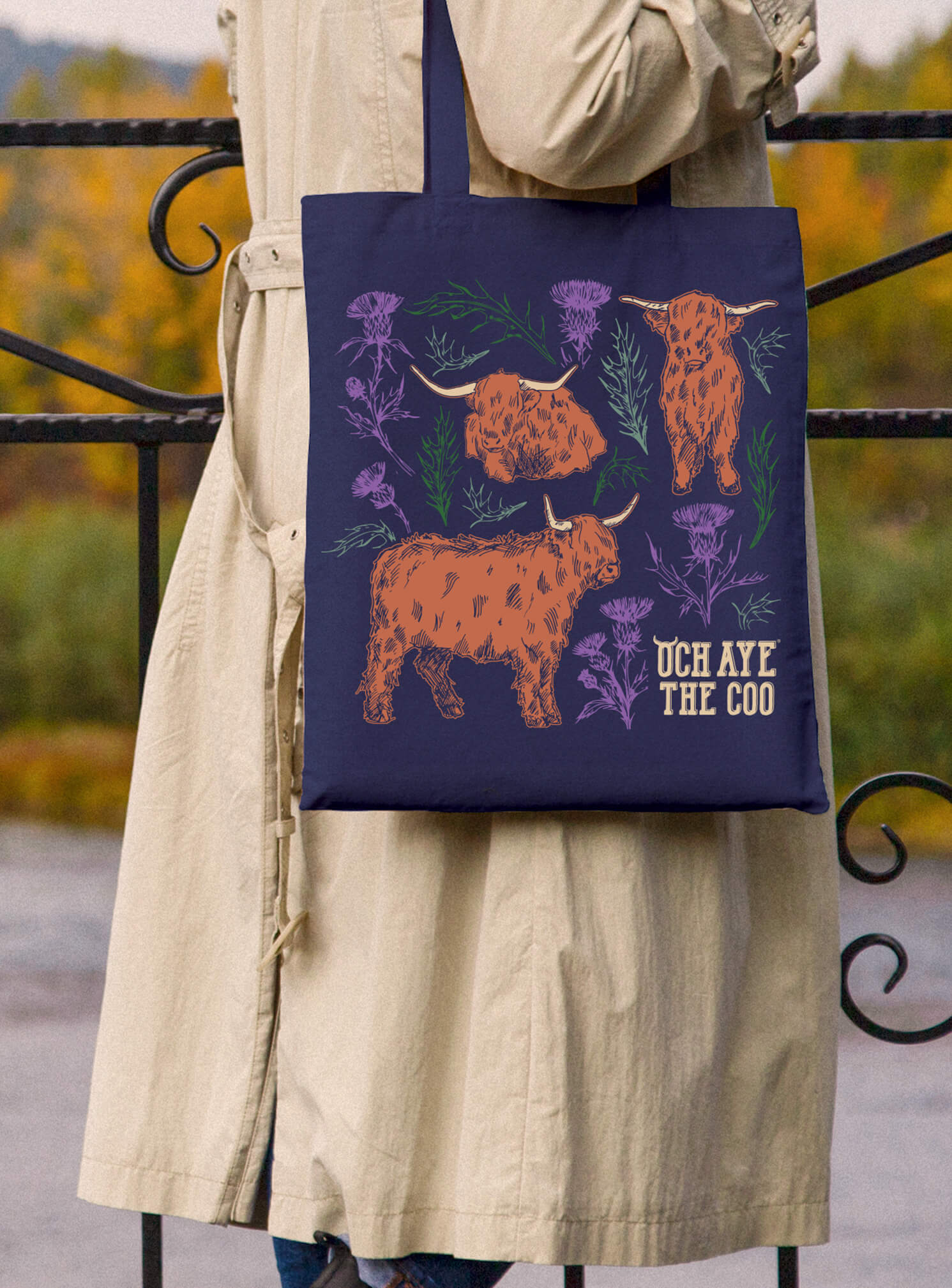 Woman with navy tote bag from our Coos & Thistles collection over her shoulder
